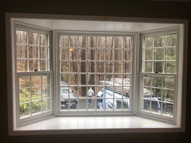 Wood bay window with single pane glass